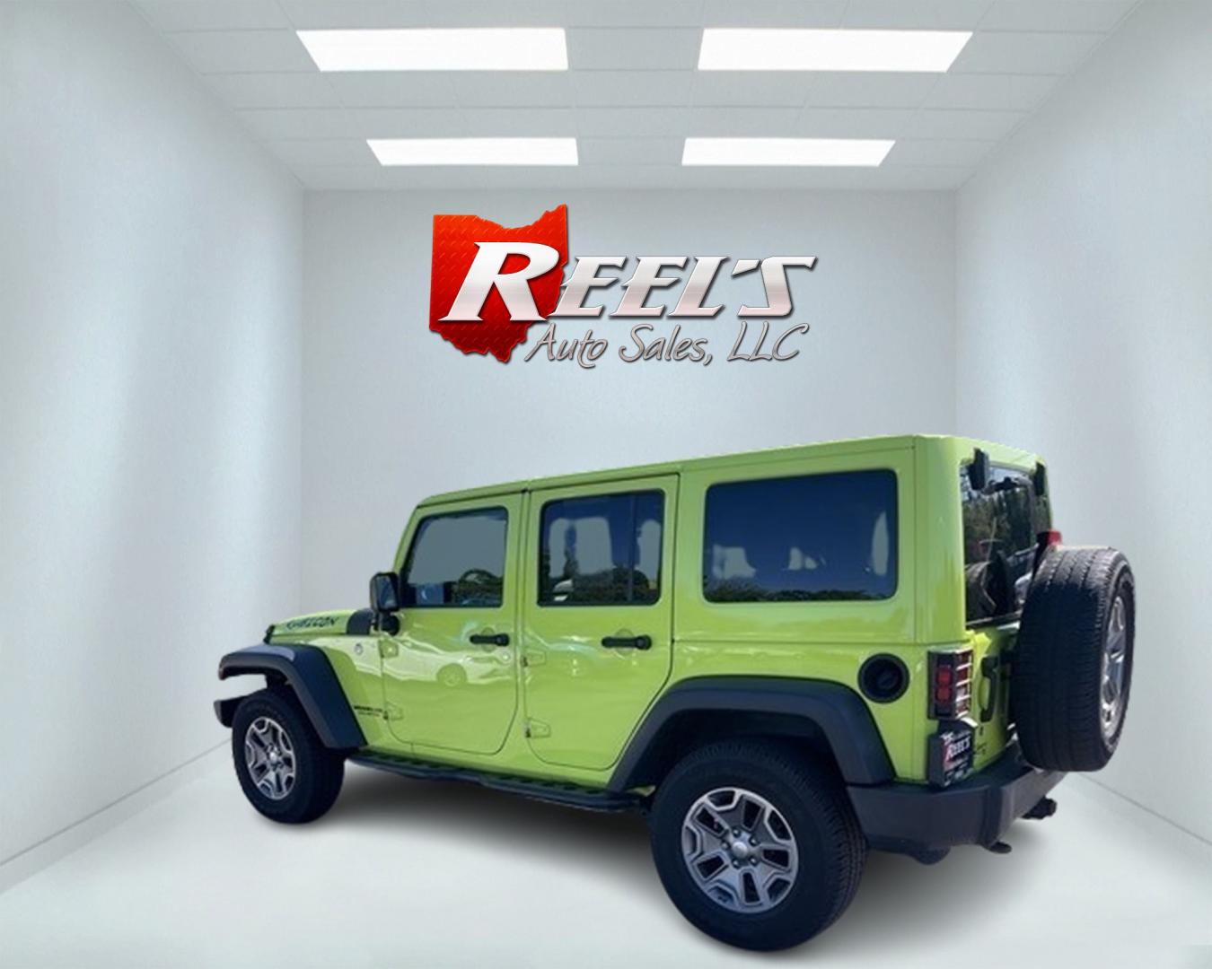 2017 Green /Black Jeep Wrangler Unlimited Rubicon 4WD (1C4BJWFG2HL) with an 3.6L V6 DOHC 24V engine, 5-Speed Automatic transmission, located at 11115 Chardon Rd. , Chardon, OH, 44024, (440) 214-9705, 41.580246, -81.241943 - This 2017 Jeep Wrangler Unlimited Rubicon is a rugged and capable off-road vehicle, equipped with a range of premium features. The exterior boasts LED headlights and fog lights, while the interior features a single-zone automatic climate control system, a 9-speaker Alpine sound system, and navigatio - Photo#8